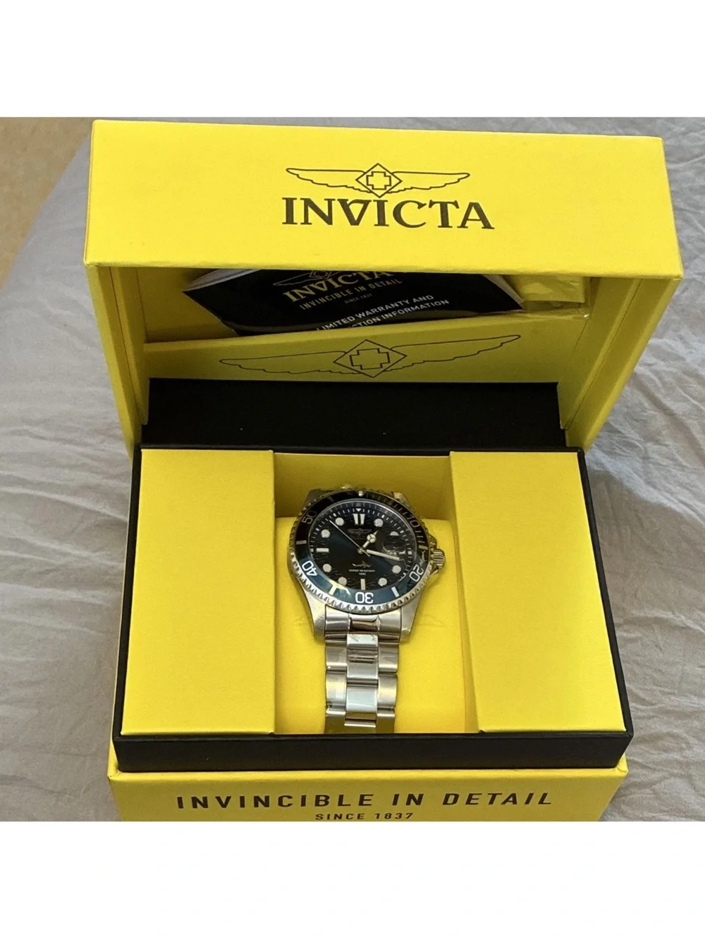 Invicta Silver Stainless Steel Watch with Blue Accents